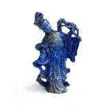 A 20th century Chinese carved lapis lazuli figure depicting Guanyin, Bodhisattva of compassion,