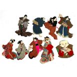 A collection of nine Japanese Oshie craft fabric characters, depicting samurai and courtesans in