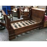 A mahogany veneer French sleigh bed, with slatted base, 127cmW