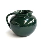A C.H Brannam, Barnstaple, green glazed jug, undgerglaze green, marked to base