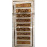 A framed Burmese bible in Pali, each panel approx. 11x53cm, overall framed dimensions 175x74cm