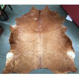 Two cow hide rigs, each approx. 200cmL