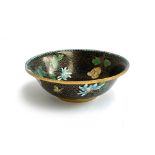 A cloisonne bowl with magnolia decoration on a black ground, 21cmD