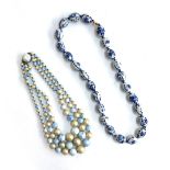 A blue and silver coloured triple stranded bead necklace together with a blue and white Chinese