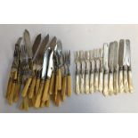 A set of six Victorian silver and mother of pearl handled fruit knives and forks, Sheffield 1866;