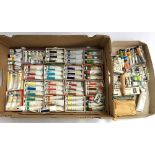 A large box of various Winsor and Newton and Rowney oil paints, with a metal easel