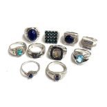 Ten 925 silver rings with various blue stones (one damaged) , gross weight 98g