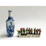 A small blue and white Oriental vase, chrysanthemum and cherry blossom decoration, marks to base,