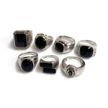 Seven 925 silver rings with black stones, gross weight 75g