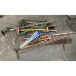 A quantity of long handled tools to include hoes, fork, spade, pickaxes etc