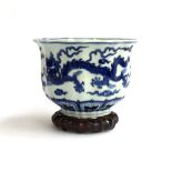 A Chinese blue and white vase, with flared scalloped rim, the exterior decorated with a dragon among