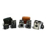 A mixed lot of cameras to include three Kodak box brownies, a Baby Brownie, and a Coronet (5)