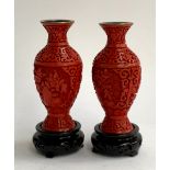 A pair of Chinese cinnabar lacquer vases brass vases, intricately carved foliate design, blue enamel