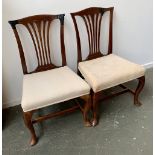 A pair of early 18th century style oak dining chairs, with stuffover seats, the cabriole legs with