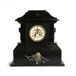 A large 19th century slate mantel clock, with brass mounts, on a wooden plinth base, in need of some