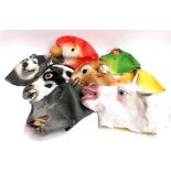 A lot of eight rubber animal masks, including wolf, parrot, frog, cow, mouse, duck, hippo and a