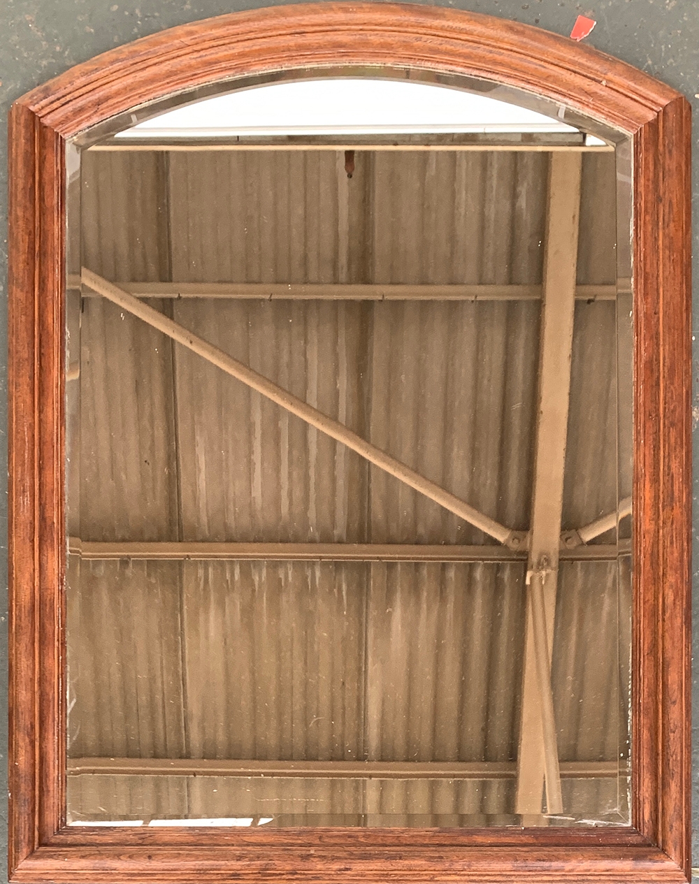 A heavy domed wall mirror, with bevelled glass, 91x71cm