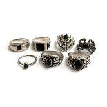 Seven 925 silver rings with black stones including one in the form of a spider , gross weight 59g