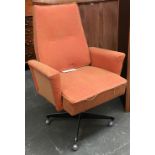 A mid century swivel office chair by Reason Ardale, upholstered in red fabric