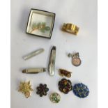 Mixed lot of brooches, a Festival of Britain badge, 3 mother of pearl penknives, one silver marked