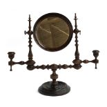 An unusual 19th century gent's adjustable shaving mirror, on turned supports with turned candle