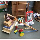 A mixed lot of toys to include hobby horse, push along toys, fairy lights etc