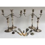 A pair of three arm plated candlesticks, each 43cmH; together with a further pair and several plated