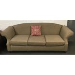 A brown upholstered three seater sofa, 235cmW