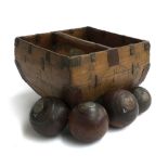 An Oriental rice measure, 35cm2; together with four antique boules