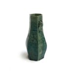 A green glazed Chinese Vase with cicada decoration, 21cmH