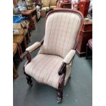 A 19th century mahogany salon chair, recently re-upholstered, on turned legs and casters