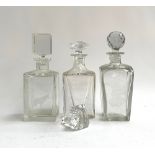 Three decanters to include a Baccarat crystal decanter of square form, with spare stopper, 23.