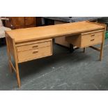 A mid century beechwood kneehole desk, flanked by four drawers, 159x50x69cmH