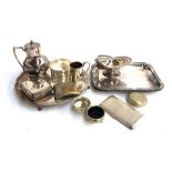 A mixed lot of plated wares to include salver, cigarette cases, hip flask, snuff box, mug, salts,