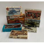 A mixed lot of Airfix and other makes of scale models including a Landrover No.1 Tonne FC Ambulance;