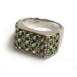 9ct white gold dress ring decorated with green stones, gross weight 10.3g