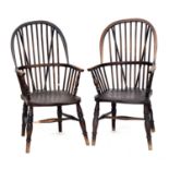 A pair of 19th century Windsor chairs, turned arm supports, shaped seat on baluster turned legs