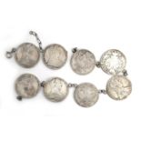 A string of eight Maria Theresa thaler coins