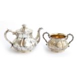 A Victorian silver teapot and sugar bowl, by Robert Hennell III, London 1849 and 1859, of shaped