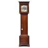 A late 18th century oak longcase clock, blind fretwork over the 12" dial flanked by brass capped