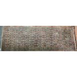 A large feraghan rug, the blue ground with all over Herati pattern within a triple border, 174x480cm