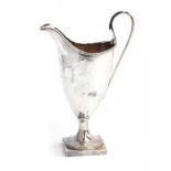 A George III silver helmet form milk jug, John Robins, London 1784, with beaded rim, bright cut