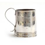 A late 17th/early 18th Century silver mug of tapered cylindrical coopered form, marks rubbed -
