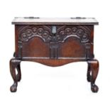 A small 18th century coffer with carved decoration, on cabriole legs with ball and claw feet, 55cm