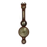 A mahogany banjo barometer, the case with engraved dials and convex mirror surmounted by a broken-