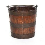 A 19th century coopered brass bound peat bucket with brass loop handle, 27cm diameter, 28cm high