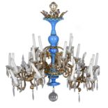 A probably Italian gilt metal and blue glass twenty four light chandelier, 20th century, the scallop