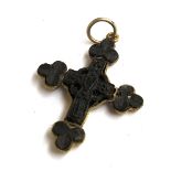 An unusual 19th century gilt metal and carved bog oak cross surrounded by shamrocks, approx. 4.5cm