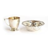 A silver christening cup by William Comyn & Sons, London 1936, 8.2cm high; together with a pierced