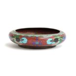 An early 20th century Chinese cloisonne enamel bronze bowl, depicting a dragon with flaming pearl,